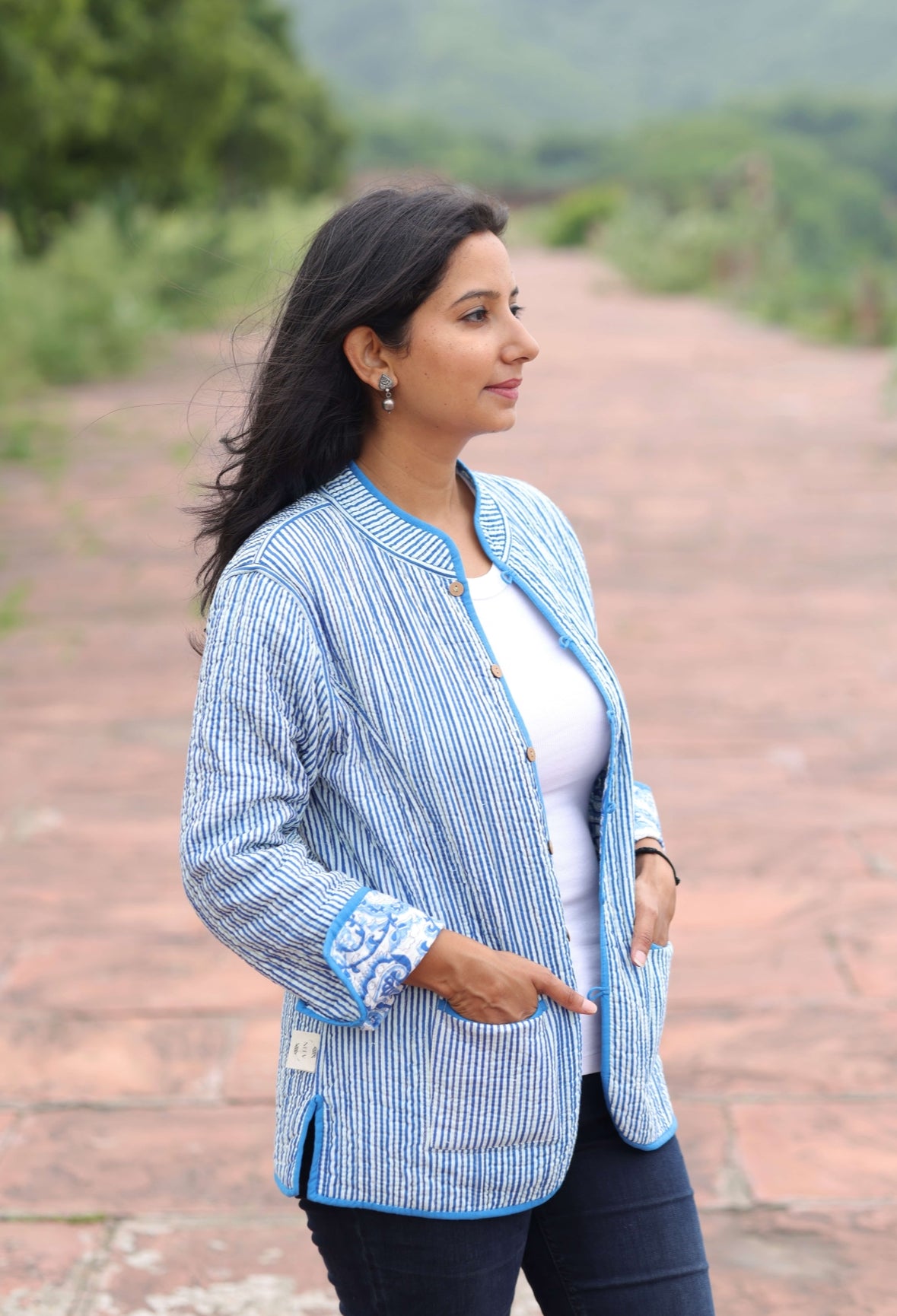 Woman wearing a blue striped reversible Block Printed Summer jacket