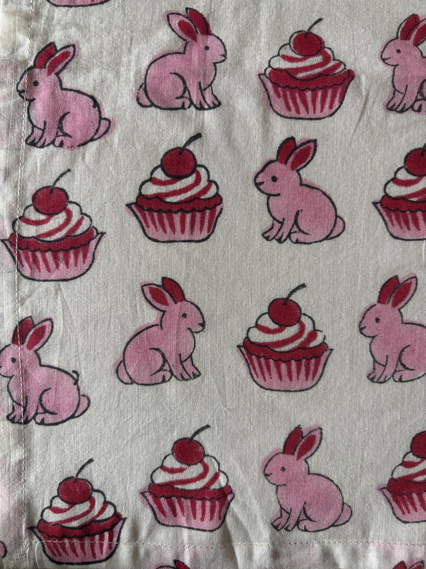 Pattern of pink cbunniyes with pink cherry cupcakes