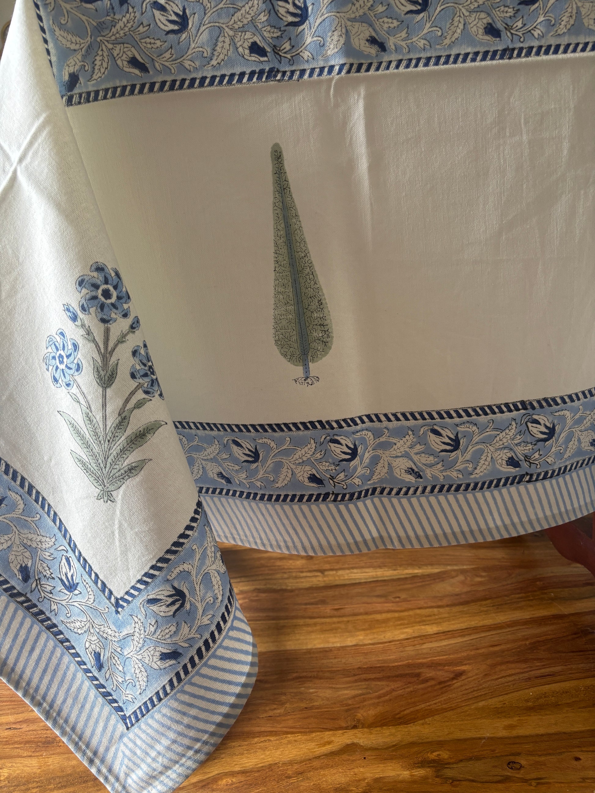 Blue table cloth with broad border with motifs
