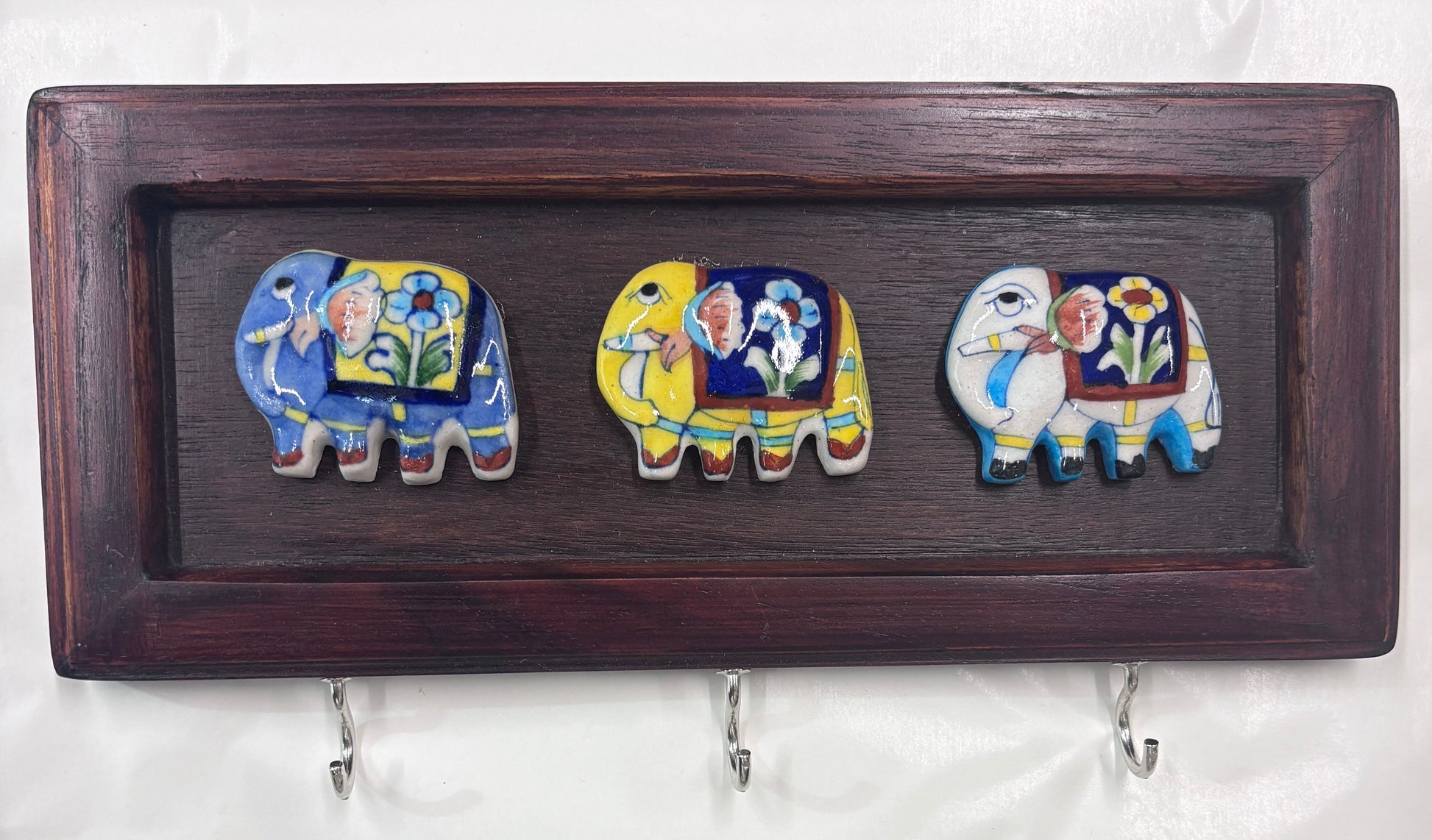 Blue Pottery elephant key holder in wooden frame