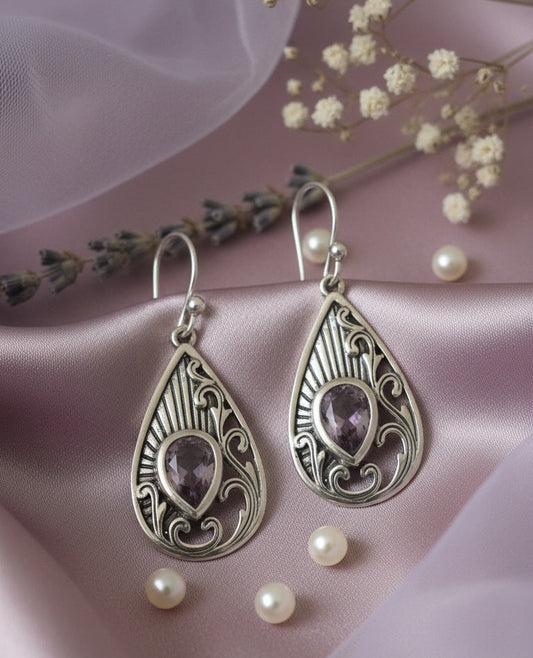 Silver teardrop earrings with purple stones 