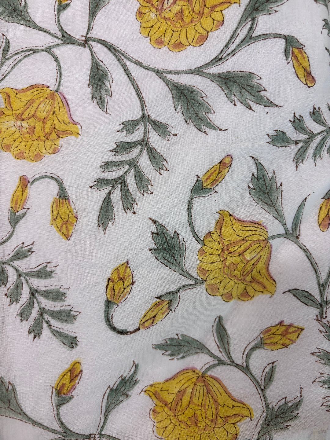 Floral pattern with yellow flowers and green leaves on a white background