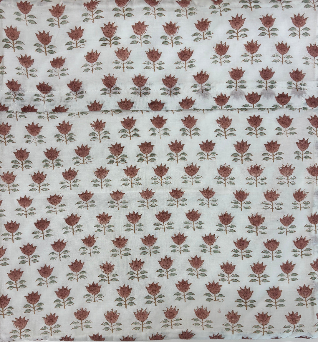 Floral patterned fabric with red flowers on a white background