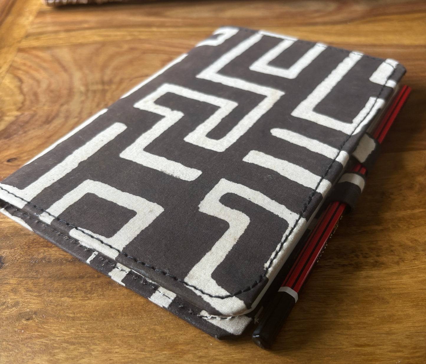 Black and white patterned notebook with pencil lock feature