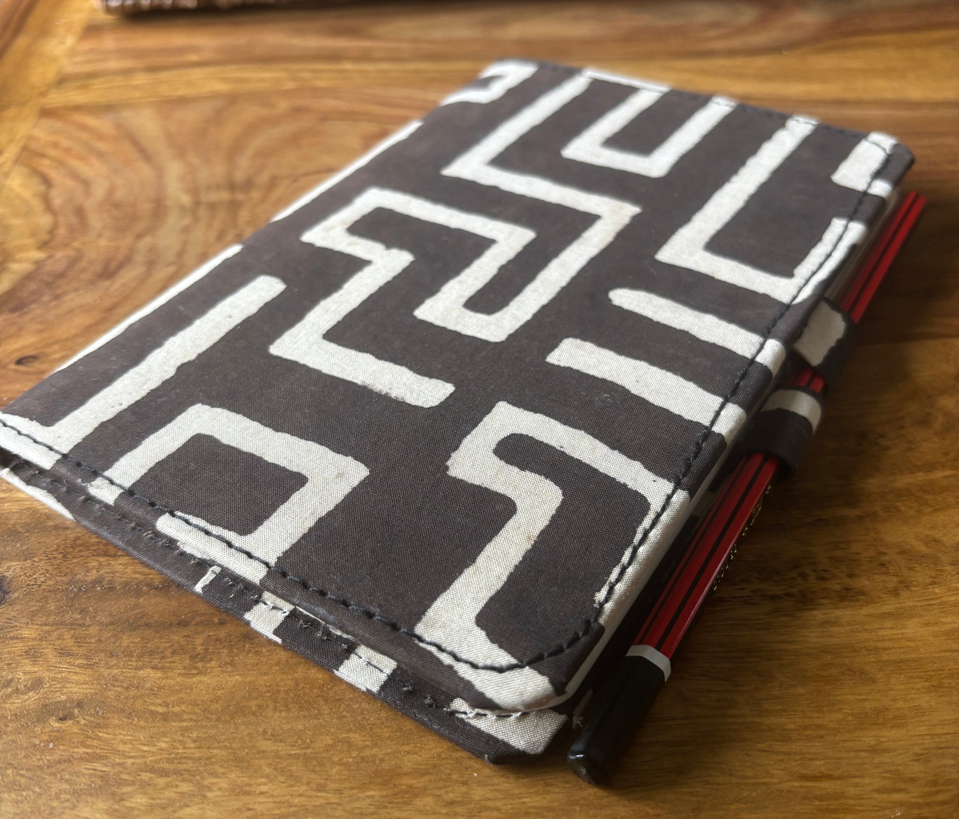 Black and white patterned notebook with pencil lock feature