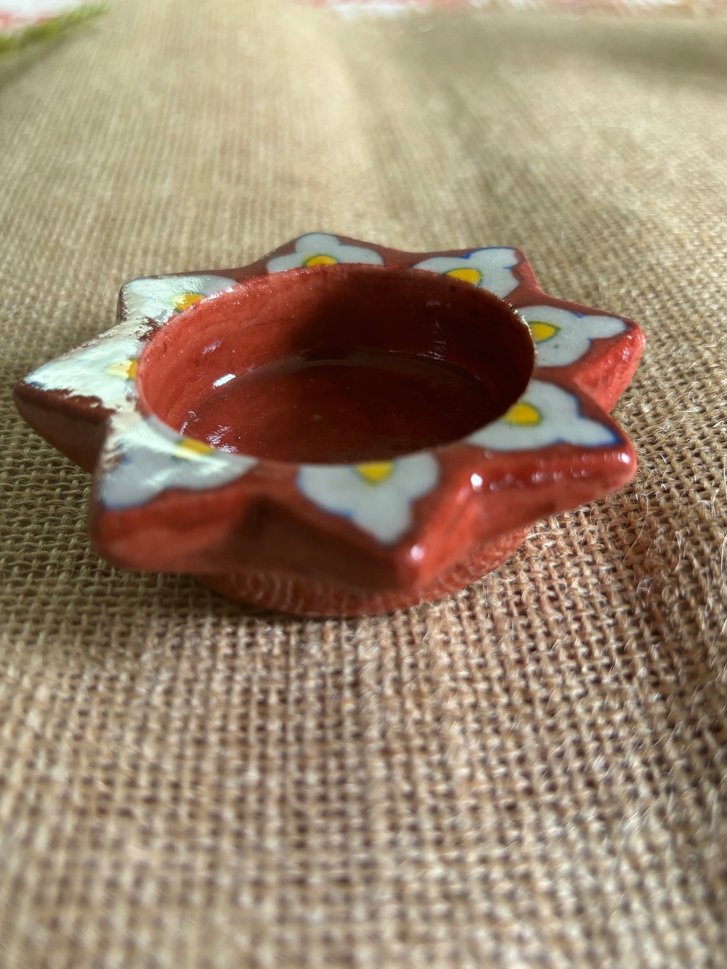 Red flower blue pottery tea light holder