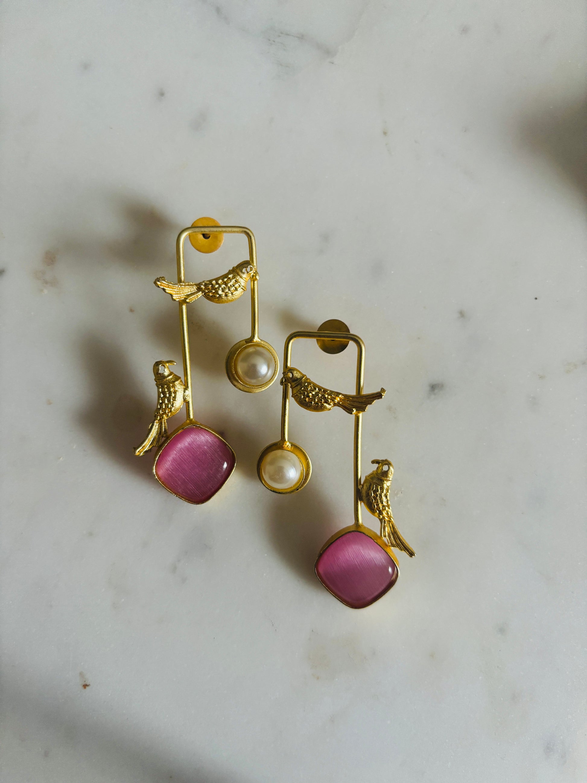 Golden sparrow pearl drop earrings with pink accents and delicate bird design, handcrafted fashion jewellery.