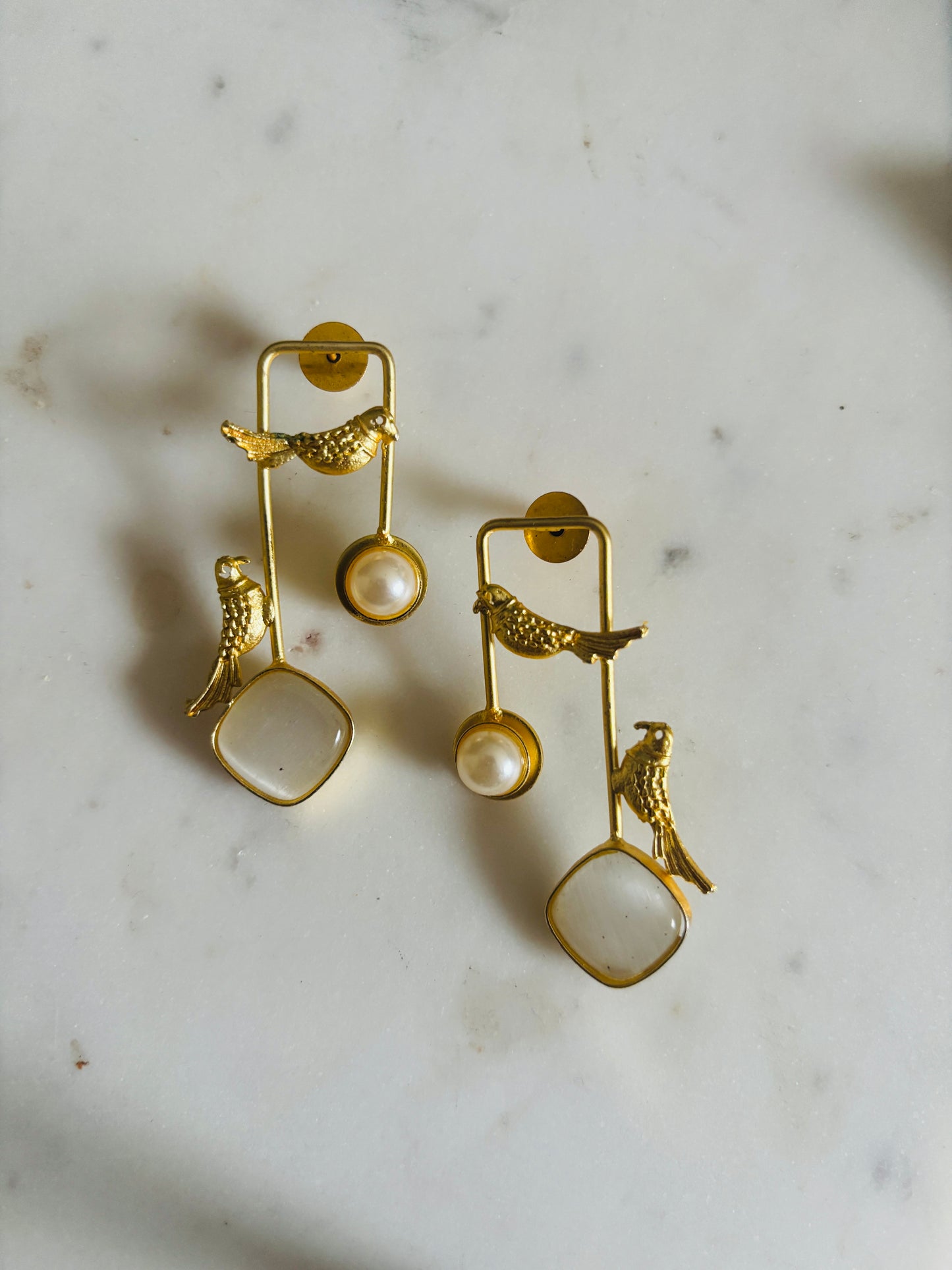 Golden sparrow pearl drop earrings with lustrous pearl and detailed bird motif, handcrafted fashion jewellery.