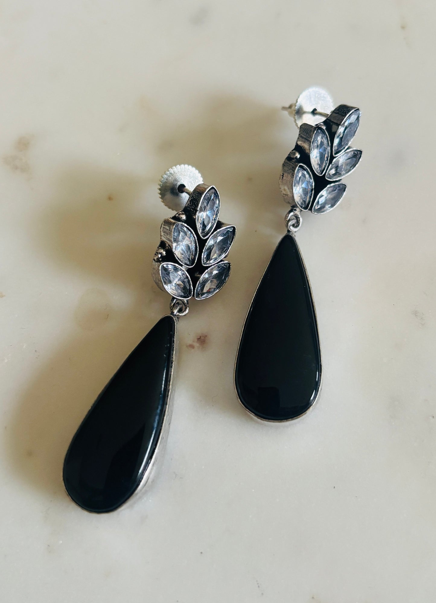 Midnight leaf teardrop earrings in black with leaf‑inspired design and sleek teardrop silhouette, handcrafted fashion jewellery.