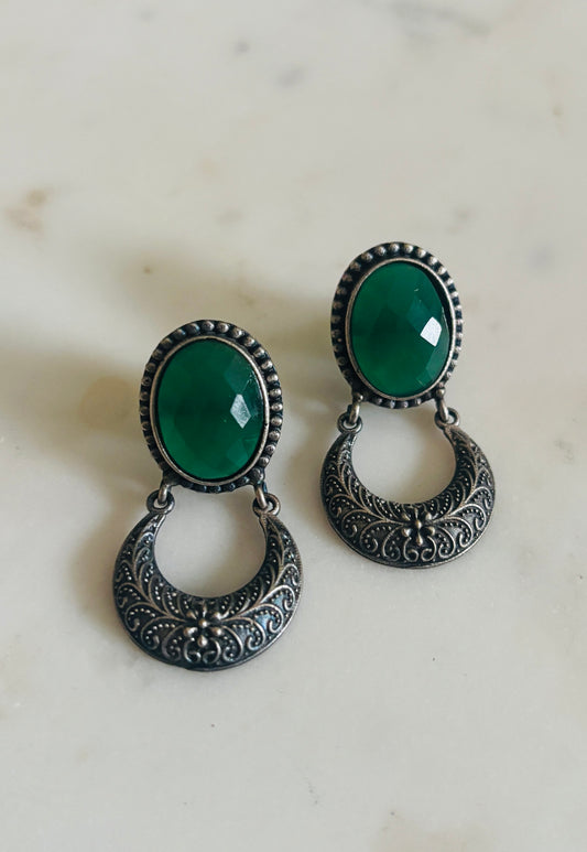 Crescent oxidised drop earrings with emerald green stone and antique‑style detailing, handcrafted fashion jewellery.