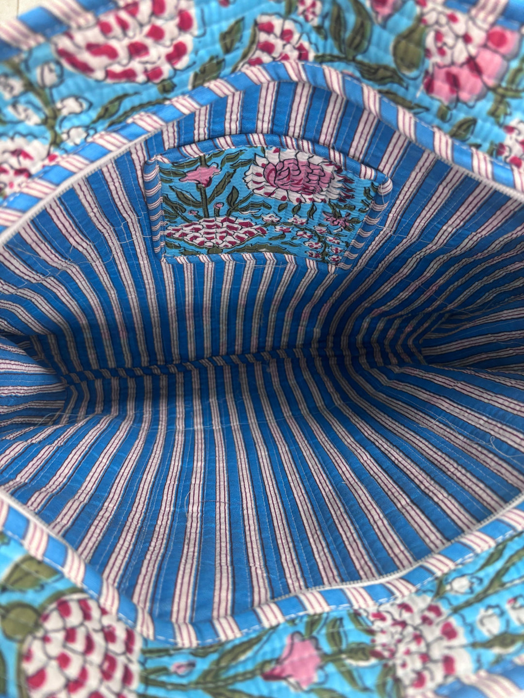Inside of the tote the cotton quilted blur tote bag