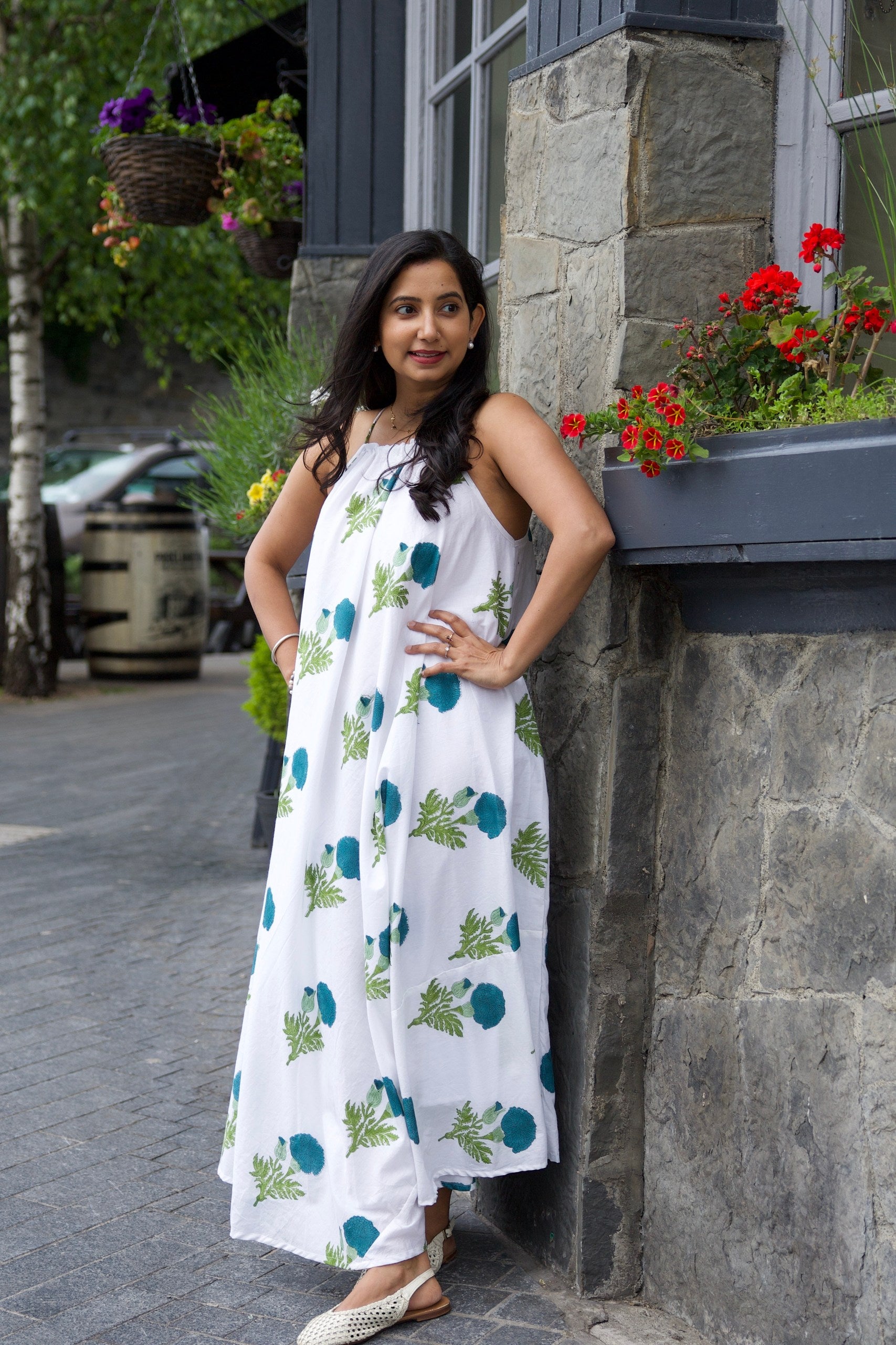 White cotton flare dress with dark blue marigold block print motifs and shell tie straps