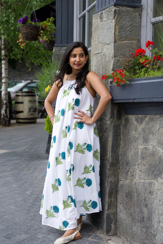 White cotton flare dress with dark blue marigold block print motifs and shell tie straps