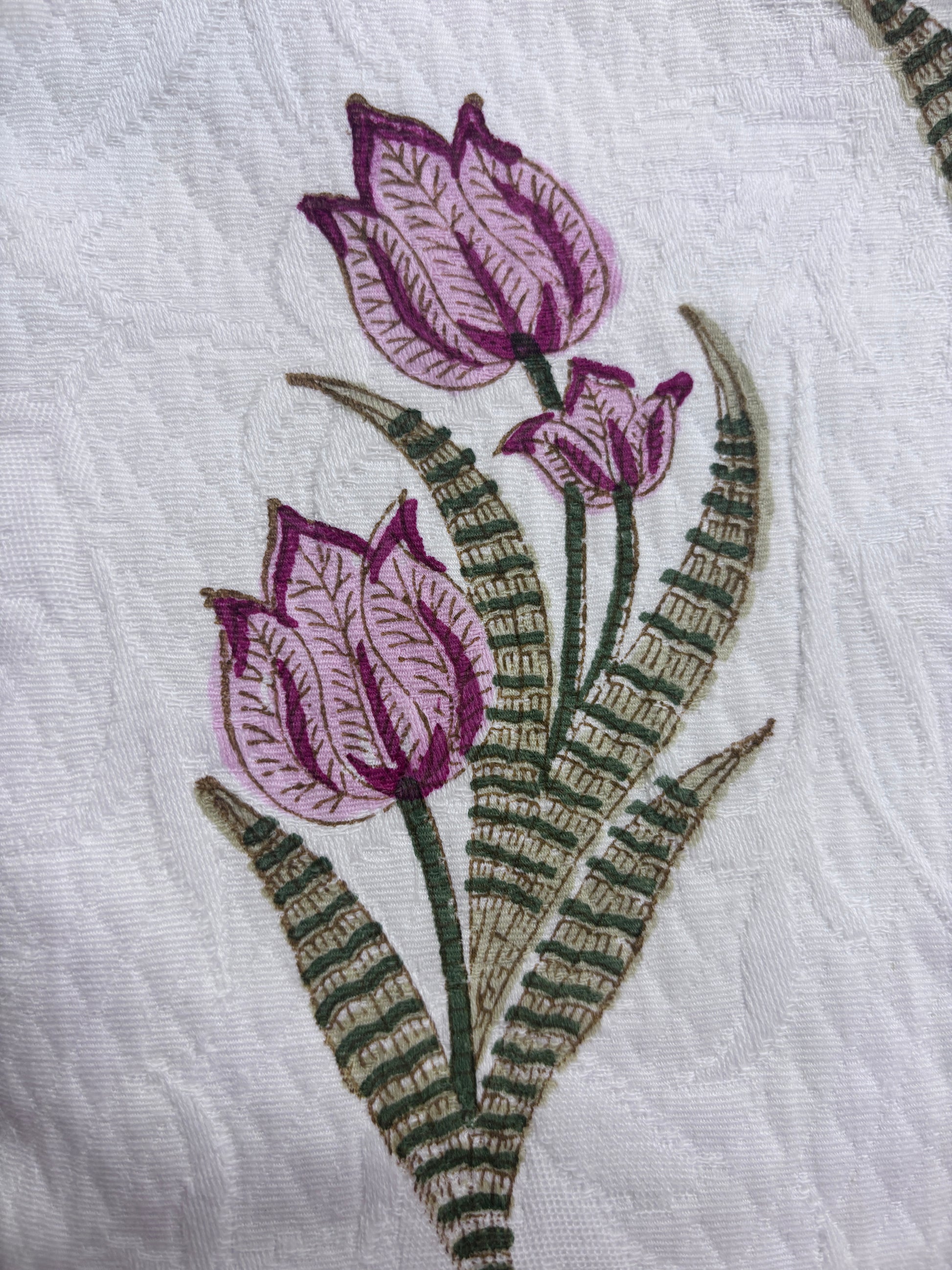Pink tulip motif on a white self textured cotton bag