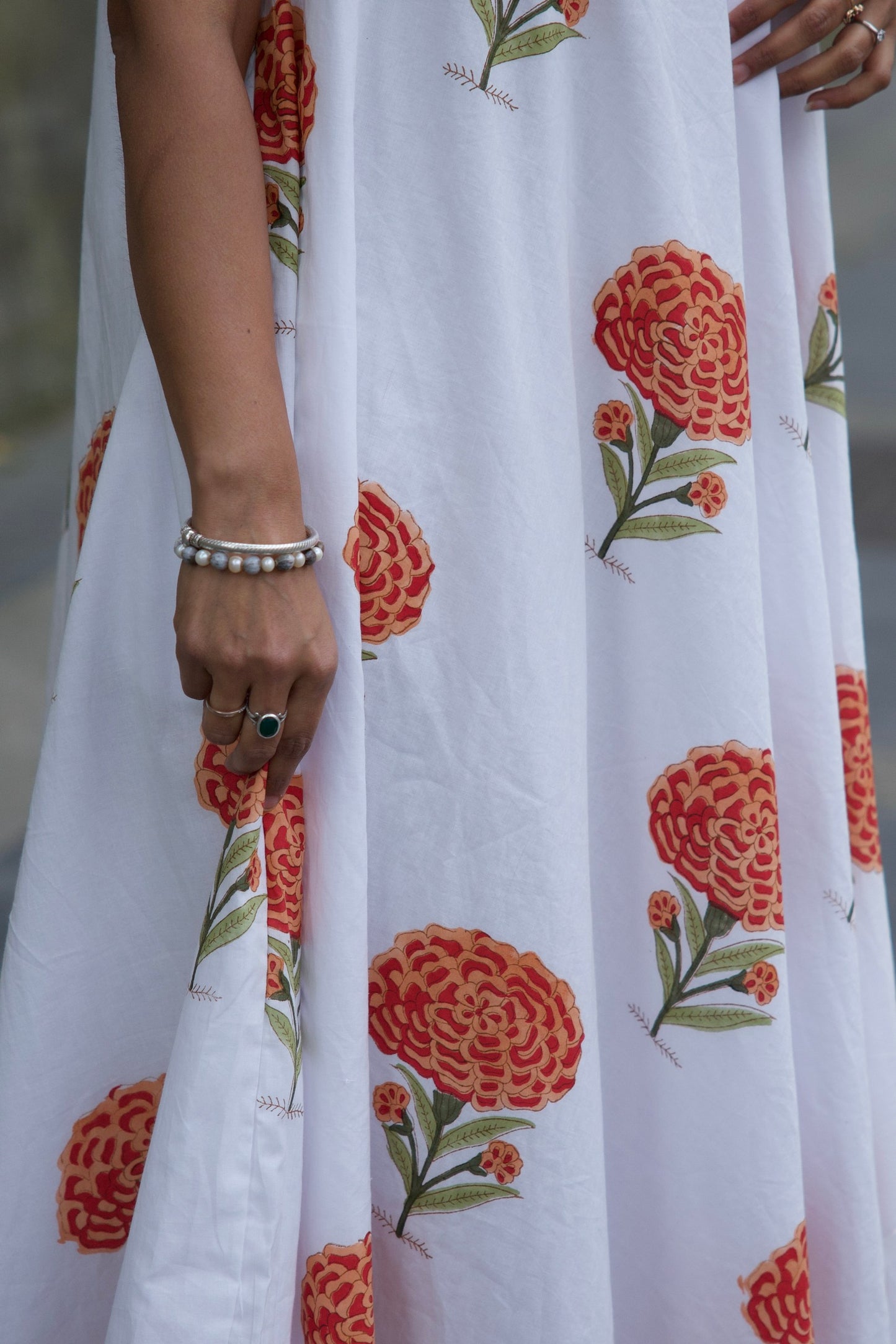 White fabric with orange floral patterns 