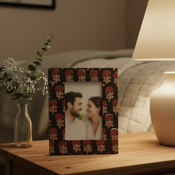 Brown and red floral block-printed photo frame holding a 3×5 photo in a handcrafted fabric frame