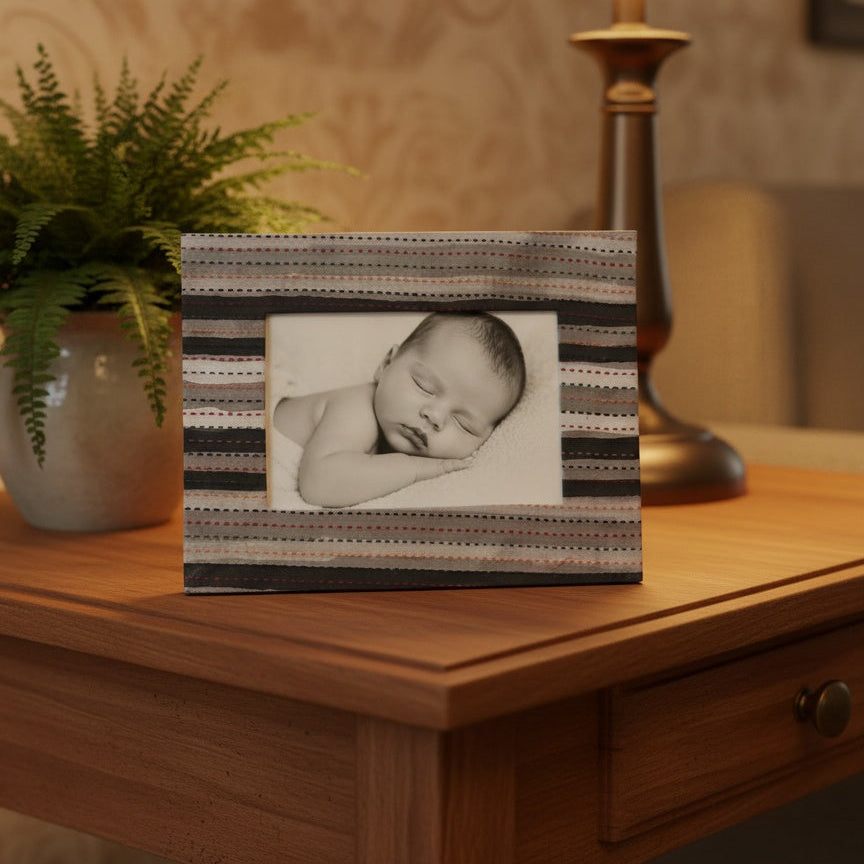 Handmade kantha stripe photo frame holding a 3×5 photograph, handcrafted fabric frame with stitched kantha detailing for home décor.